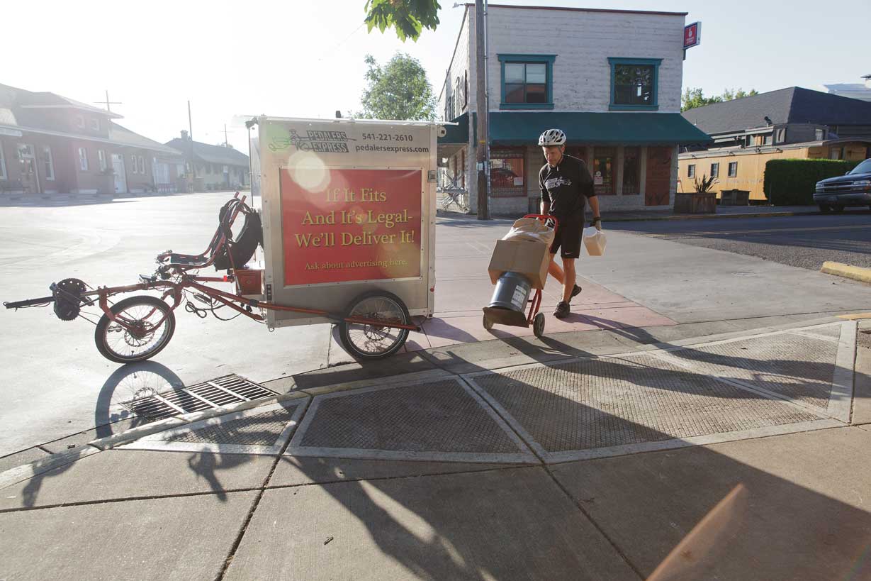 Bicycle courier completing a local delivery in Eugene, OR