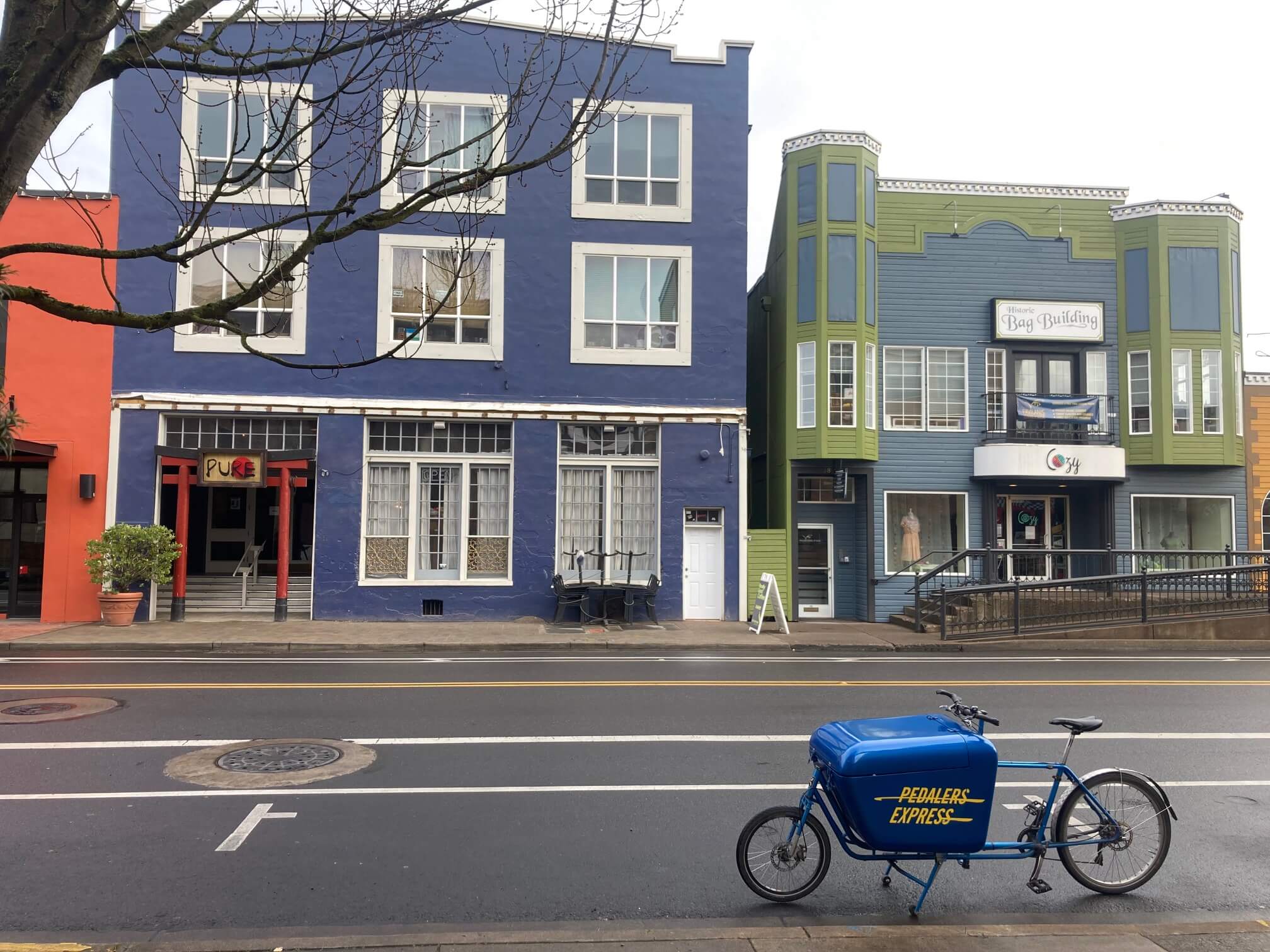 Last-mile delivery service navigating Eugene, OR streets by cargo bike